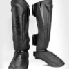 Venum Elite Evo Shin Guards worn by a martial artist