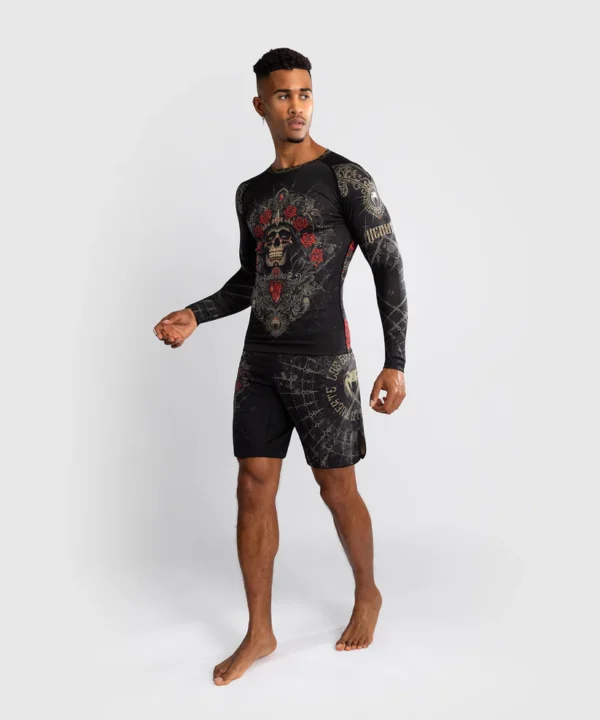 Man wearing Venum Santa Muerte 5.0 Long Sleeve Rashguard.