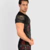 A man wearing Venum Santa Muerte 5.0 Short Sleeve Rashguard