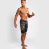 Man wearing Venum Santa Muerte 5.0 Vale Tudo Shorts