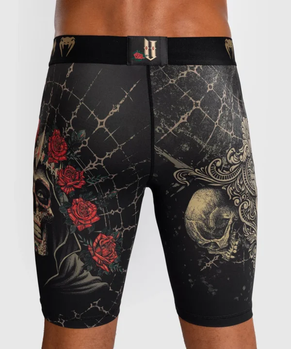 A man wearing Venum Santa Muerte 5.0 Vale Tudo Shorts