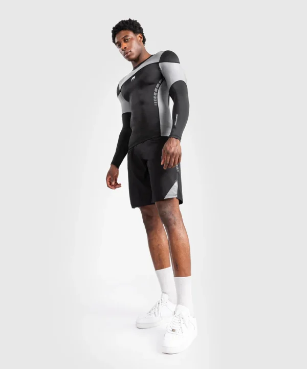 Man posing in Venum Tempest Long Sleeve Rashguard