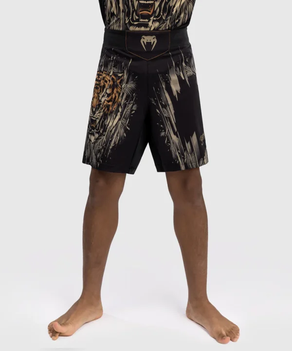 Venum Tiger Kids Fight Shorts Product Image A kid wearing Venum Tiger Kids Fight Shorts