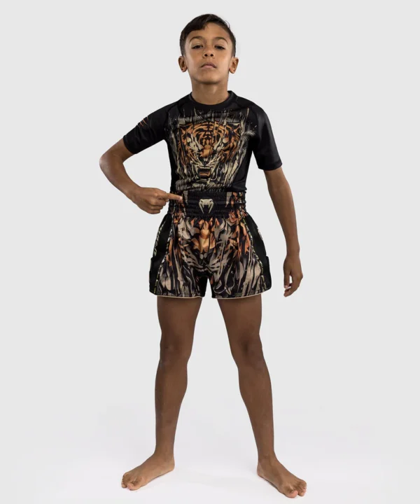 Venum Tiger Kids Muay Thai Shorts Kid wearing Venum Tiger Muay Thai Shorts
