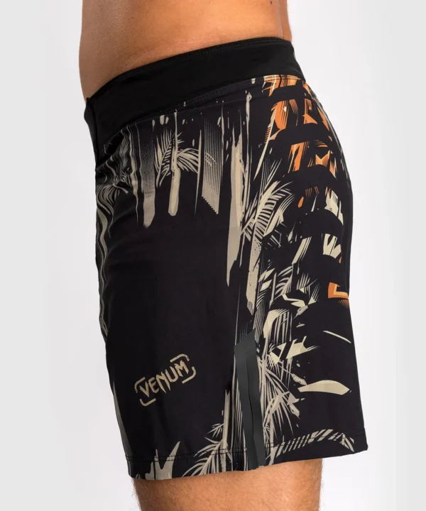 A man wearing Venum Tiger Men's Fight Shorts