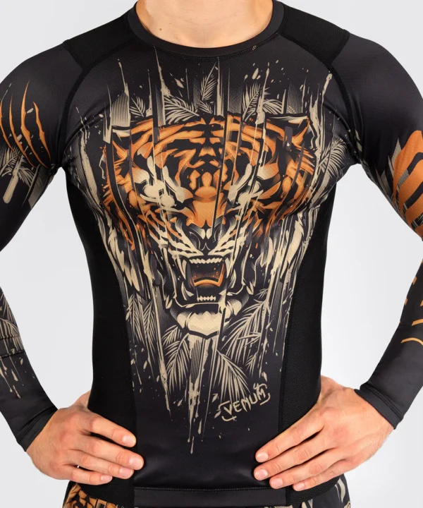 Venum Tiger Men's Long Sleeve Rashguard. A man wearing Venum Tiger Men's Long Sleeve Rashguard.