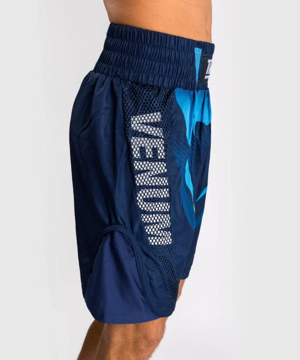 Venum x Top Rank Original Men's Boxing Shorts in action