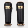 Yuth Shinguards Gold Line on white background