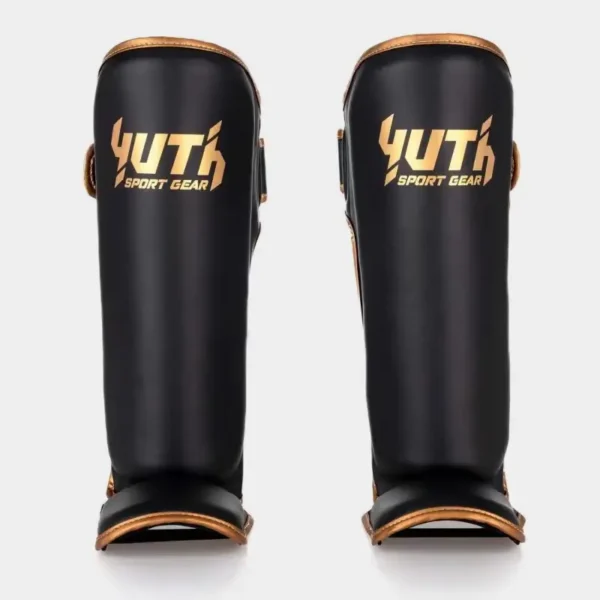 Yuth Shinguards Gold Line on white background