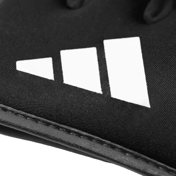 Adidas brand knuckle protectors on white background