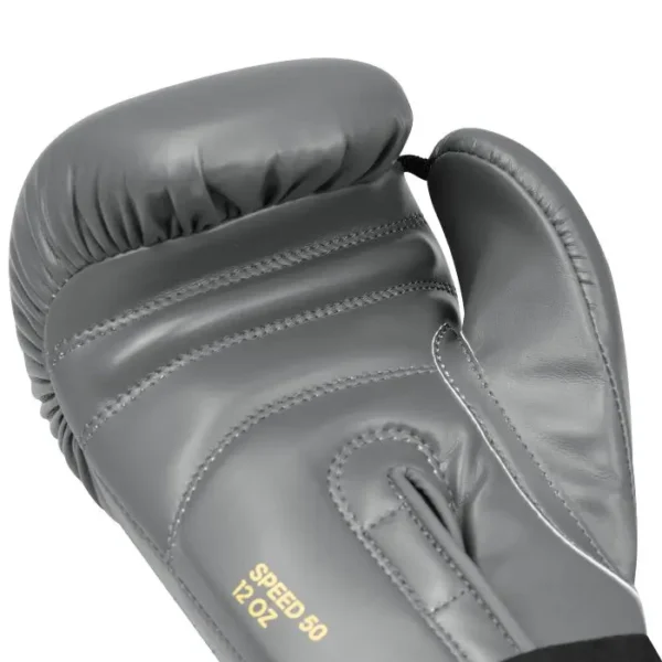 Adidas Speed 50 Boxing Gloves - Knockout Edition Black and gold Adidas Speed 50 Boxing Gloves on white background