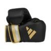 Red Adidas AdiSpeed Pro Boxing Gloves on a white background.