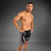 Man wearing Venum Attack Men's Vale Tudo Shorts