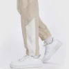 Venum Attack 90 tracksuit pant bottoms in a gym setting