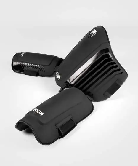 Venum Challenger Belly And Legs Protector Black 4 Venum Challenger Belly and Legs Protector on a minimalistic white background