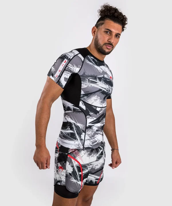 Venum Electron 3 0 Short Sleeve Rashguard Grey Red 1 Man wearing Venum Electron 3.0 Short Sleeve Rashguard