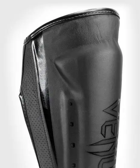 Venum Elite Evo Shin Guards on a white background