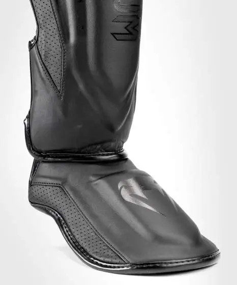 Venum Elite Evo Shin Guards on a white background