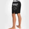 Venum Gorilla Jungle Kids Fightshorts Black White 1 Kid wearing Venum Gorilla Jungle Fightshorts