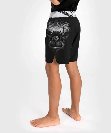 Venum Gorilla Jungle Kids Fightshorts Black White 1 Kid wearing Venum Gorilla Jungle Fightshorts
