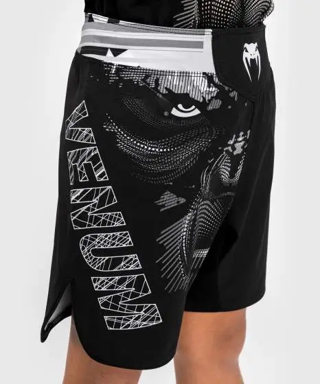 Venum Gorilla Jungle Kids Fightshorts Black White 3 Kid wearing Venum Gorilla Jungle Kids Fightshorts