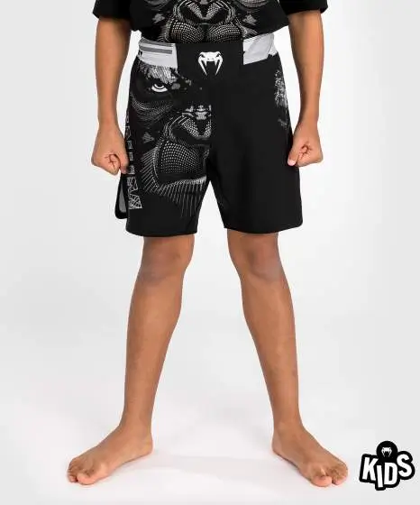 Venum Gorilla Jungle Kids Fightshorts Image Kid wearing Venum Gorilla Jungle Kids Fightshorts