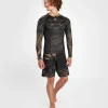 Man wearing a Venum Gorilla Jungle Long Sleeve Rash Guard.