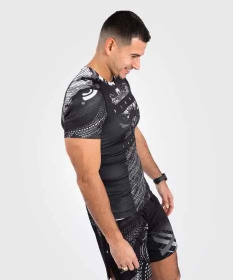 Venum Gorilla Jungle Short Sleeve Rash Guard Black White 1 Man wearing a Venum Gorilla Jungle Short Sleeve Rash Guard
