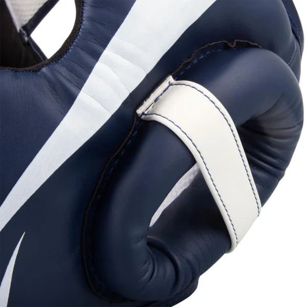Venum Elite Headgear in a boxing gym setting.
