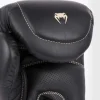 Venum Impact Evo Boxing Gloves Black 2 Venum Impact Evo Boxing Gloves in a gym setting