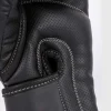 Venum Impact Evo Boxing Gloves Black 3 Black Venum Impact Evo Boxing Gloves on a display stand
