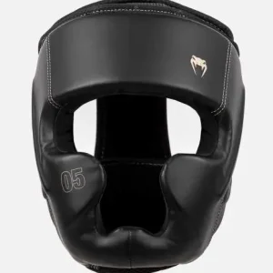 Athlete preparing for combat sport with Venum Impact Evo Headgear Head Guard