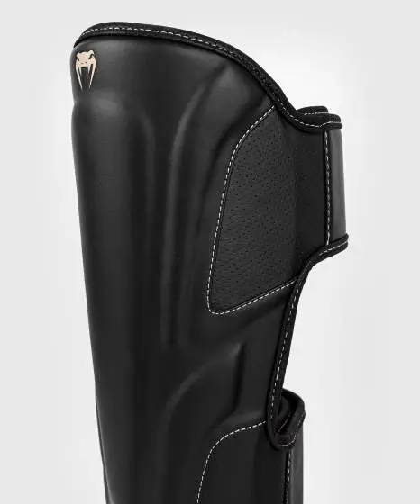 Venum Impact Evo Shinguards on a white backdrop