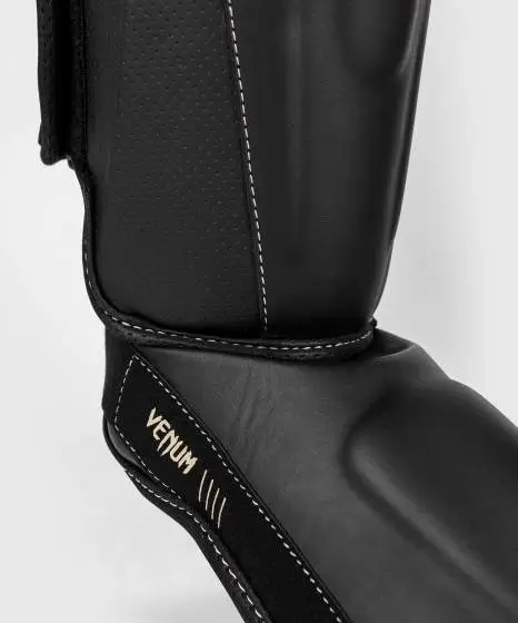 Venum Impact Evo Shinguards in action