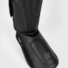 Venum Impact Evo Shinguards on white background