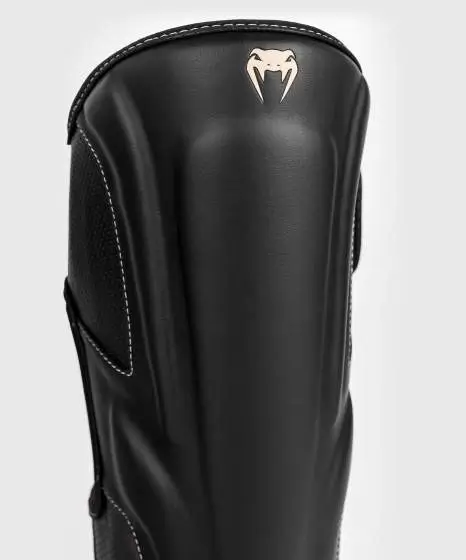 Venum Impact Evo Shinguards in black and white