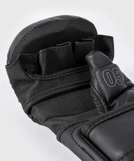 Venum Impact Evo MMA sparring gloves in black and white color scheme