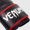 Young child wearing red Venum Kids Contender Boxing Gloves