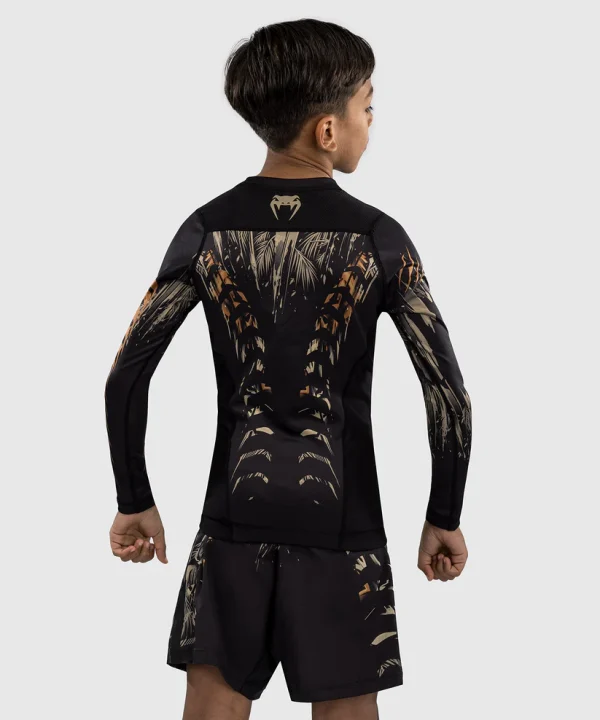 Venum Kids Tiger Long Sleeve Rash Guard Black Orange 2 Kid wearing Venum Kids Tiger Long Sleeve Rash Guard