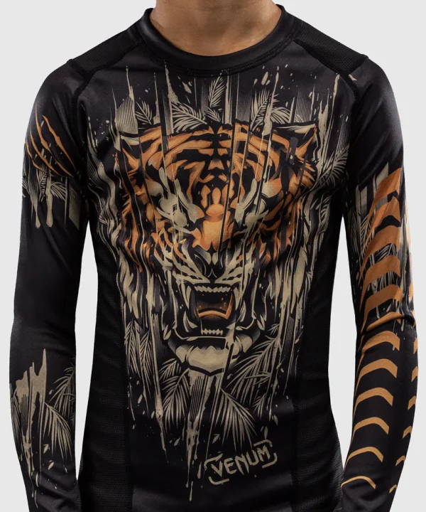 Venum Kids Tiger Long Sleeve Rash Guard Black Orange 3 Child wearing Venum Kids Tiger Long Sleeve Rash Guard