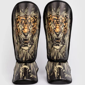 A pair of Venum Kids Tiger Shin Guards