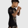 Venum Kids Tiger Short Sleeve Rash Guard Black Orange 1 Child posing in Venum Kids Tiger Short Sleeve Rash Guard
