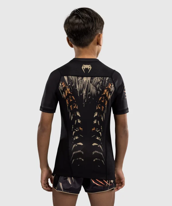 Venum Kids Tiger Short Sleeve Rash Guard Black Orange 3 Child wearing Venum Kids Tiger Short Sleeve Rash Guard.