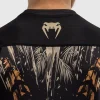 Venum Kids Tiger Short Sleeve Rash Guard Black Orange 4 A child wearing the Venum Kids Tiger Short Sleeve Rash Guard