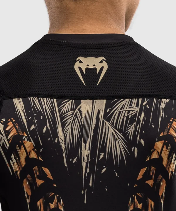 Venum Kids Tiger Short Sleeve Rash Guard Black Orange 4 A child wearing the Venum Kids Tiger Short Sleeve Rash Guard