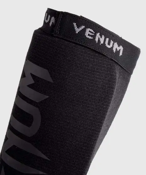 Venum Kontact Cotton Shin Guards on white background
