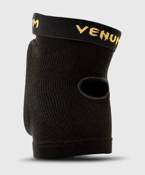 Venum Kontact Elbow Protector Guard Black Gold 2 Venum Kontact Elbow Protector Guard in black and white
