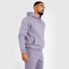 Man wearing Venum Silent Power Hoodie in a gym setting