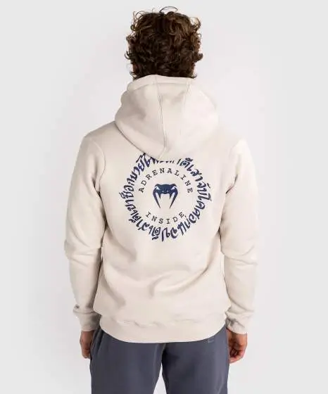 Man wearing a Venum Strikeland Full Zip Hoodie
