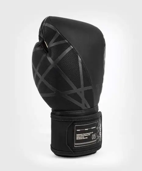 Venum Tecmo 2 0 Boxing Gloves Black 3 Closeup of Venum Tecmo 2.0 Boxing Gloves in professional setting